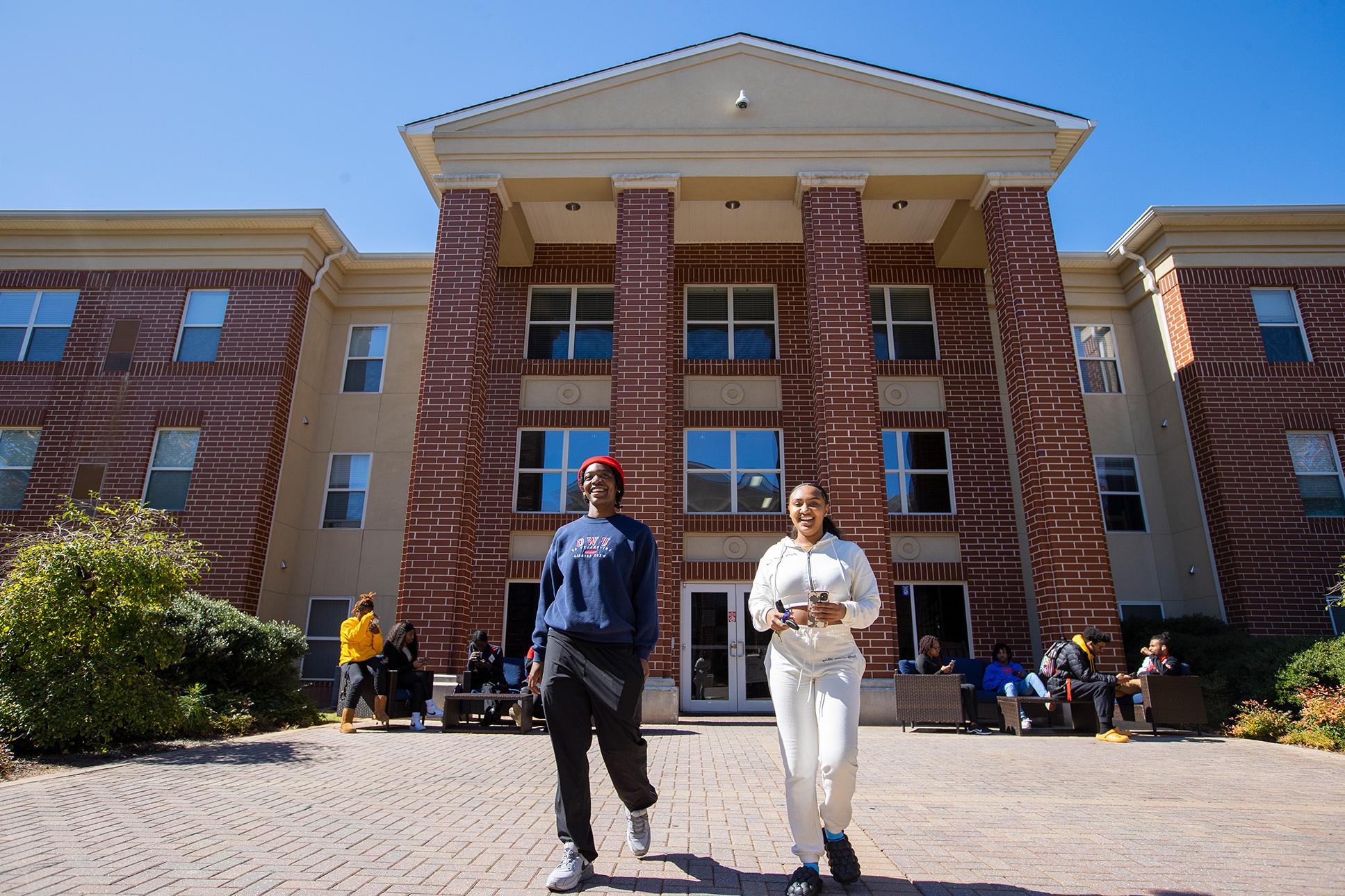 Students walking out of residence hall